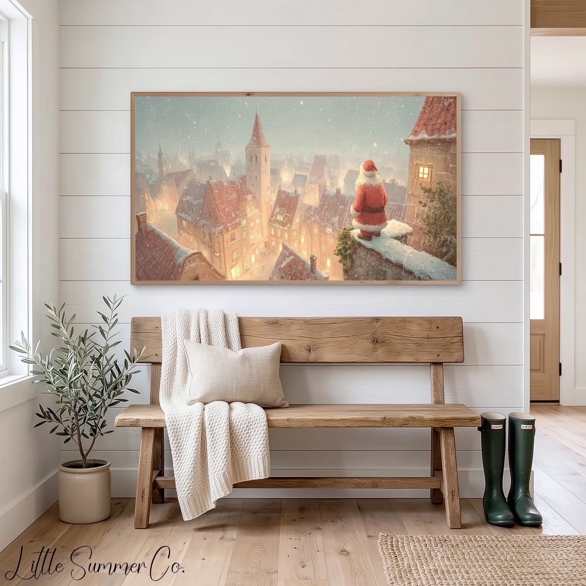 Santa Over Snowy Town Frame TV Art displayed on a TV