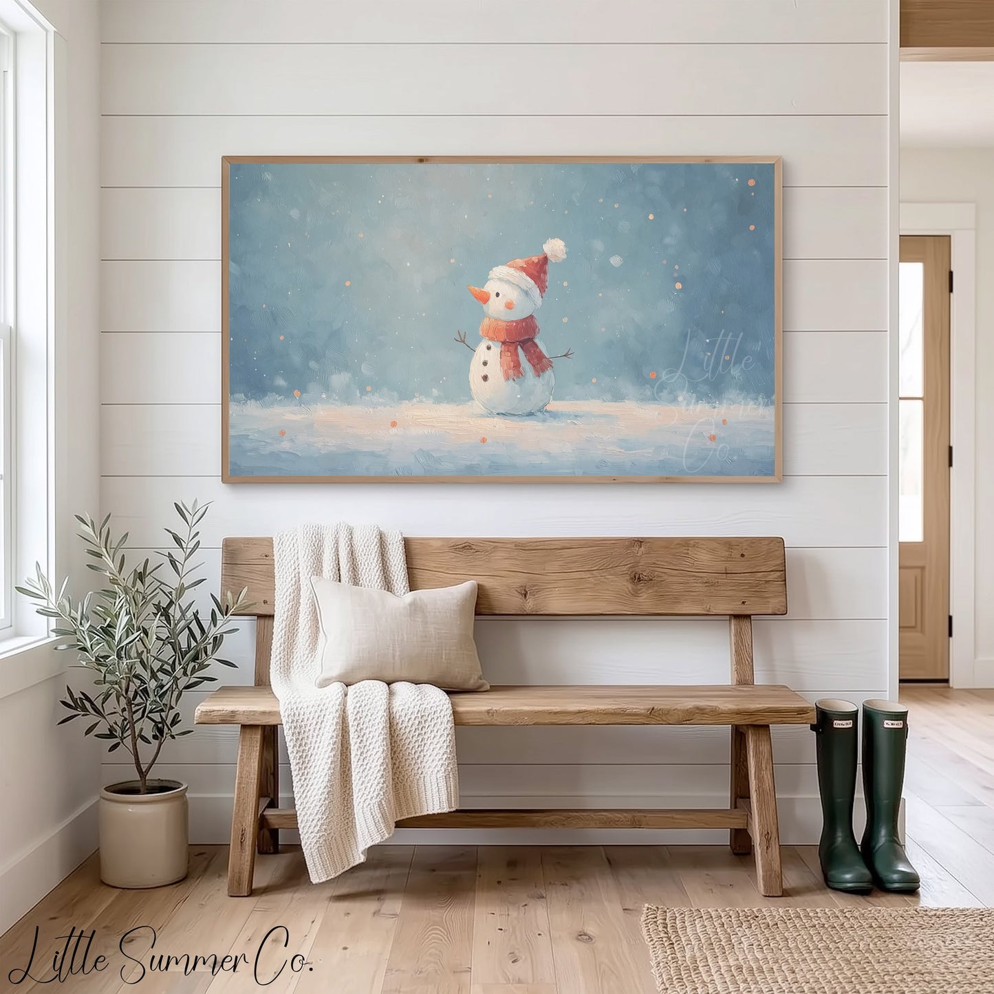 Snowman in the Snow Frame TV Art displayed on a TV