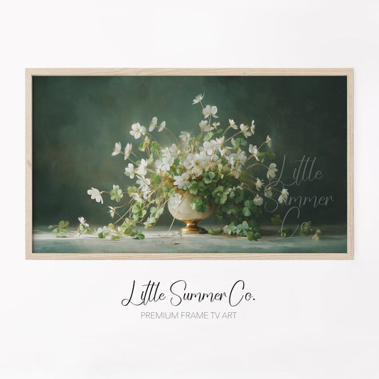White Shamrock Flowers in Urn Frame TV Art displayed on a TV