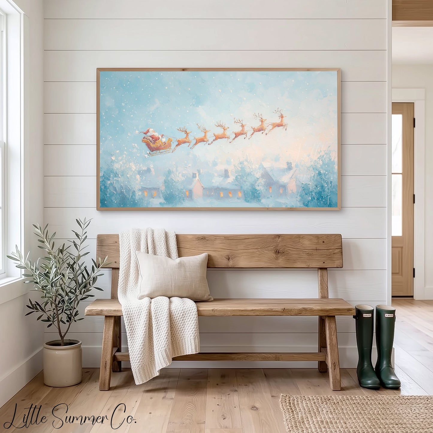 Santa's Sleigh over Snowy Village Frame TV Art displayed on a TV