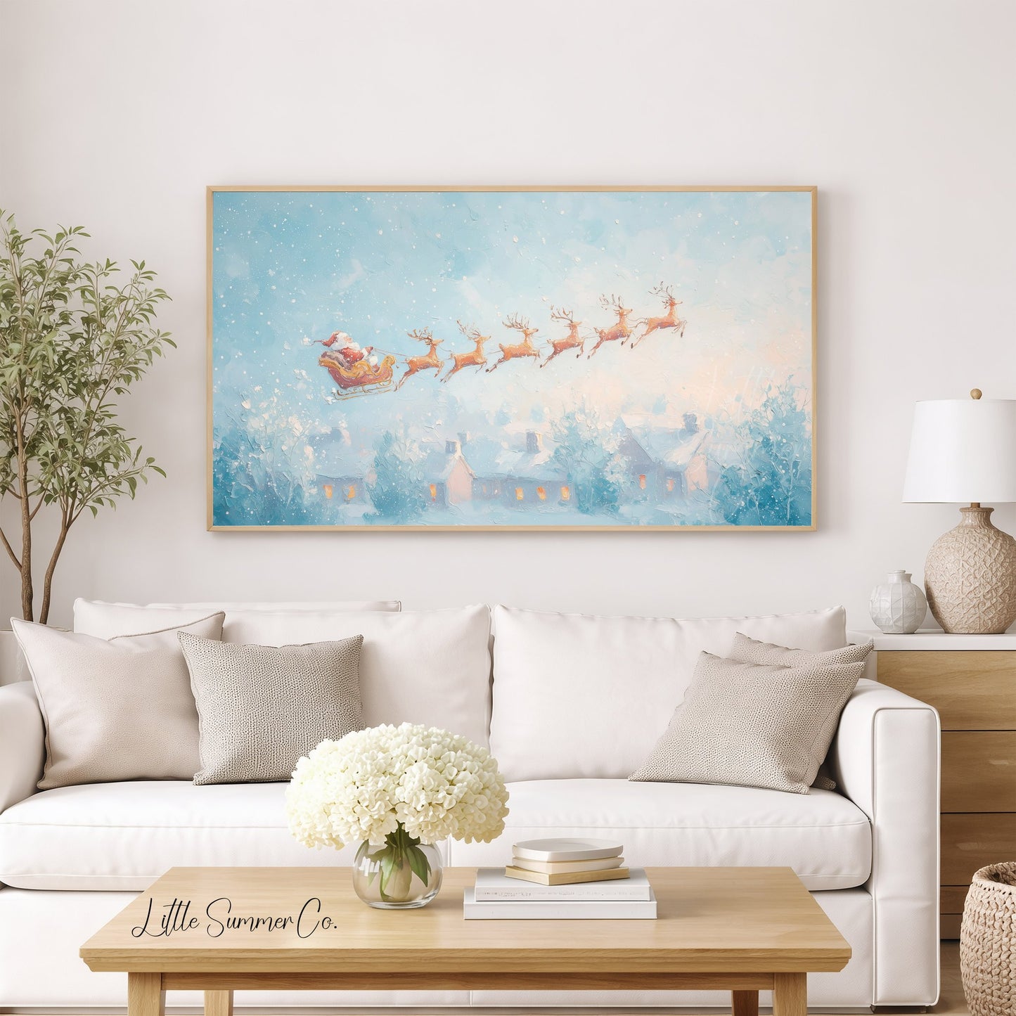 Santa's Sleigh over Snowy Village Frame TV Art displayed on a TV