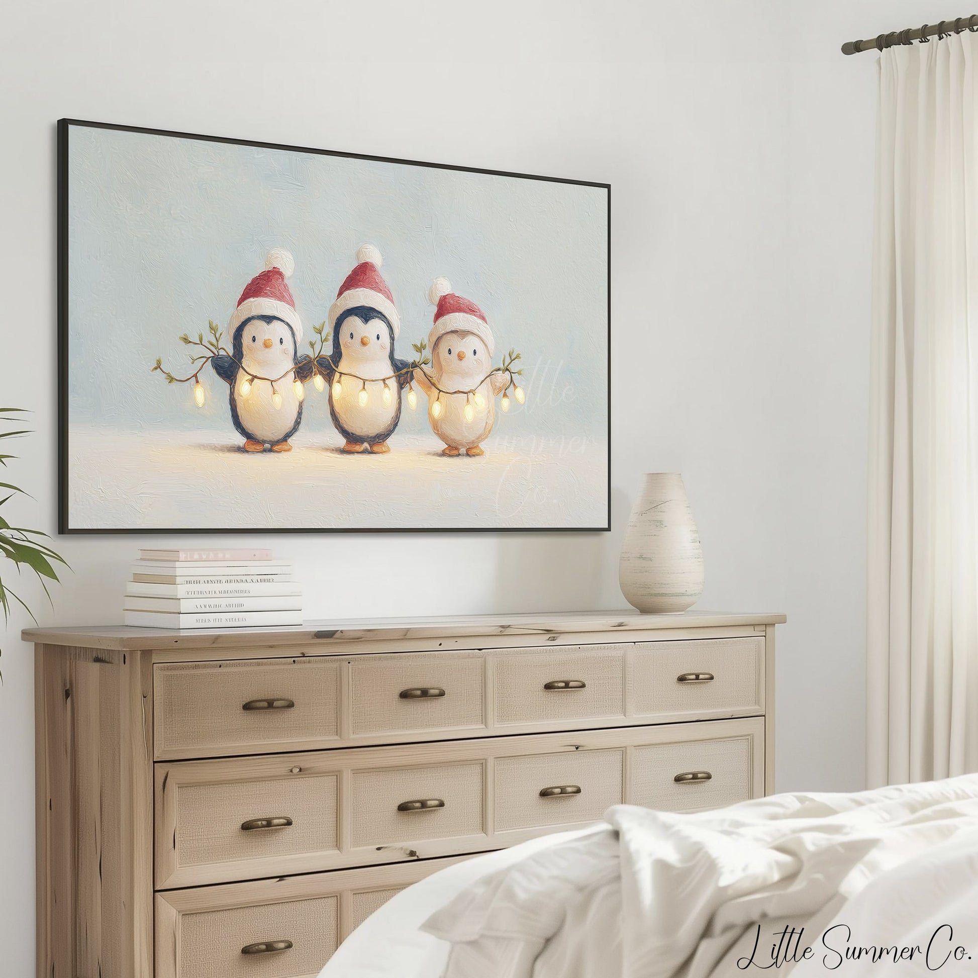 Penguins Holding Fairy Lights Frame TV Art displayed on a TV
