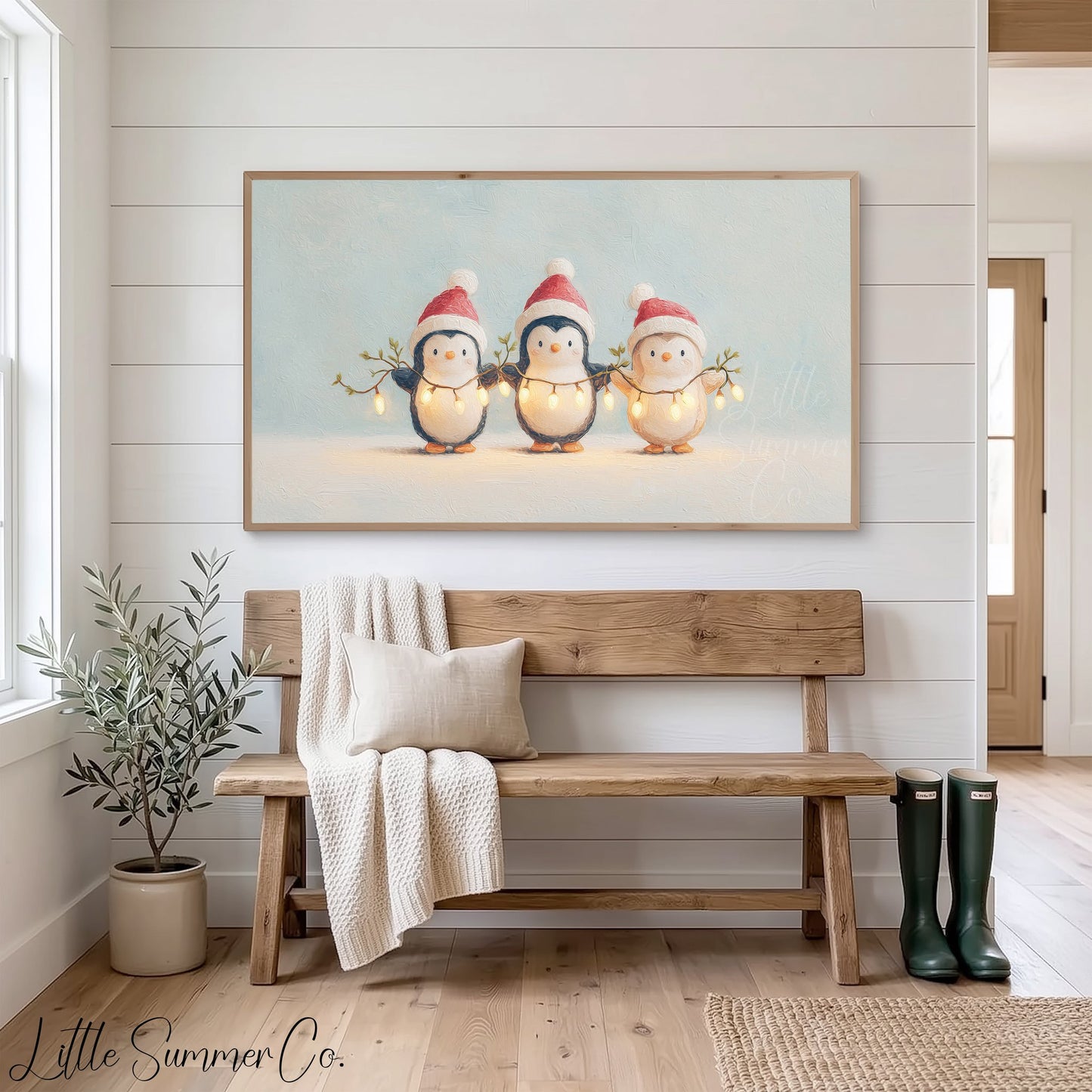 Penguins Holding Fairy Lights Frame TV Art displayed on a TV