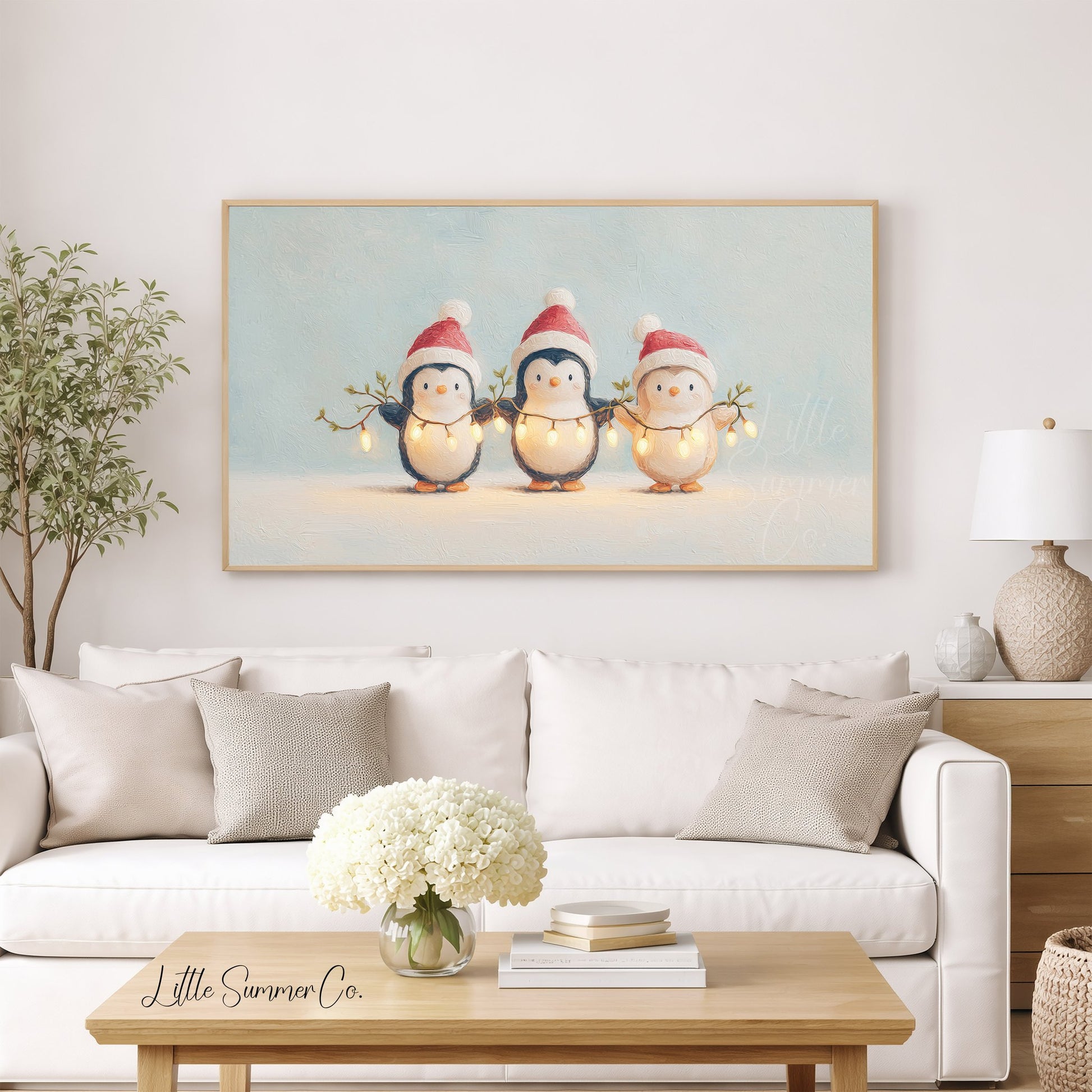 Penguins Holding Fairy Lights Frame TV Art displayed on a TV