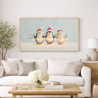 Penguins Holding Fairy Lights Frame TV Art displayed on a TV
