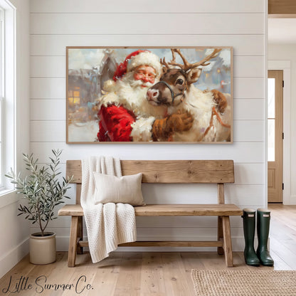 Santa Hugging a Reindeer Frame TV Art displayed on a TV