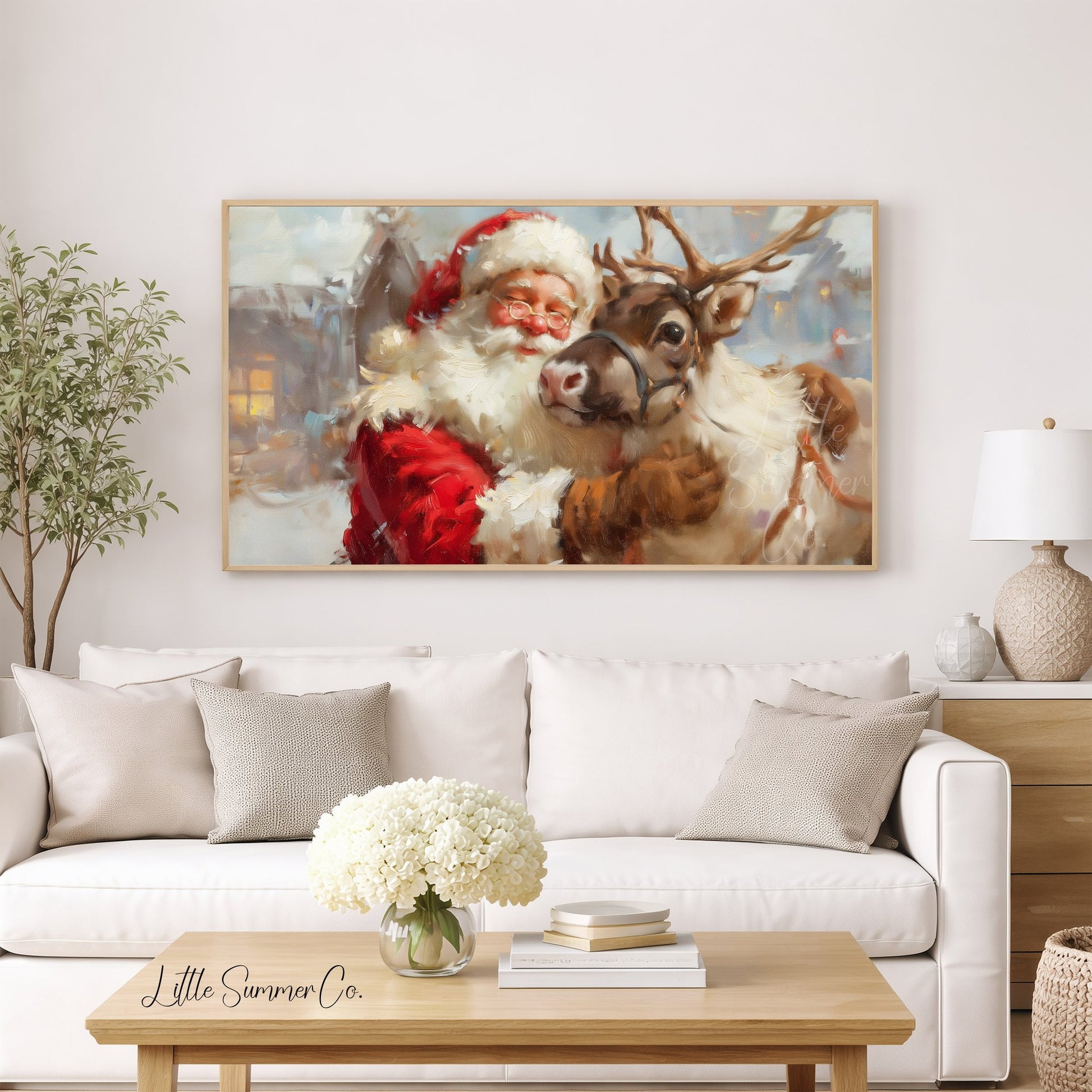 Santa Hugging a Reindeer Frame TV Art displayed on a TV
